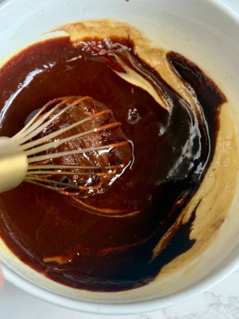 espresso brownies-mixing chocolate with whipped eggs