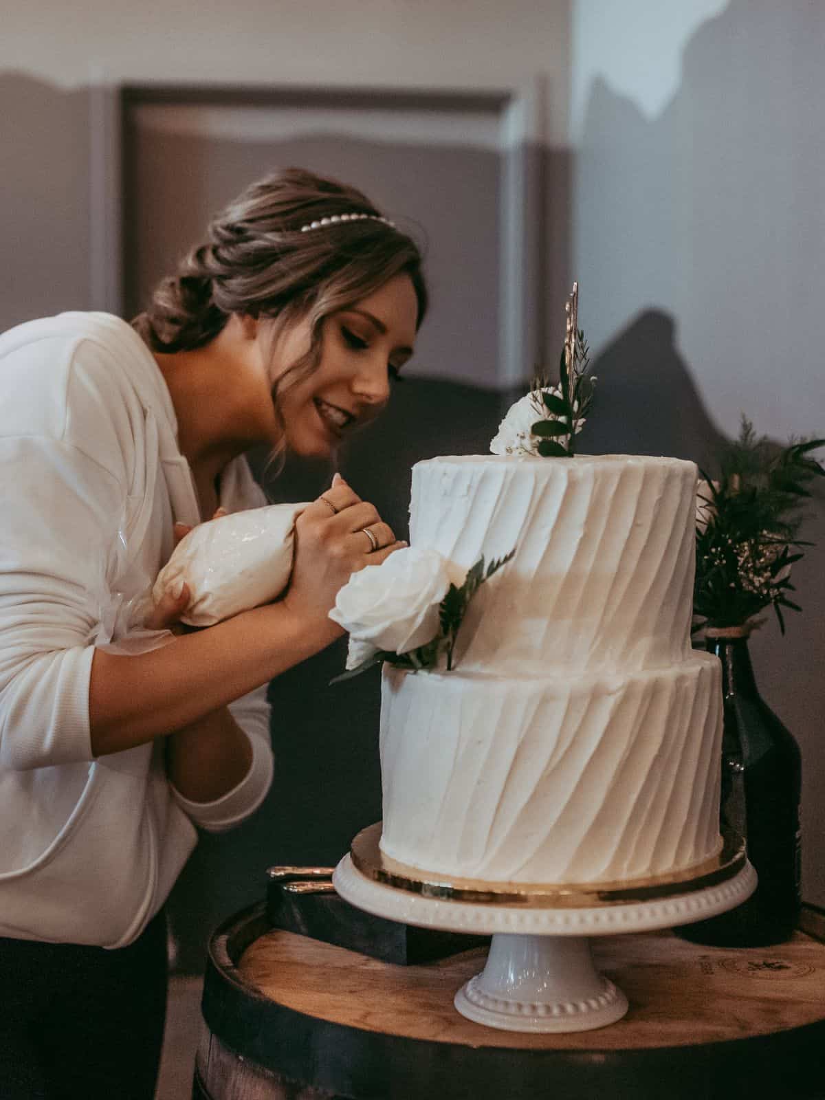 blue mountain baker - Katie decorating a wedding cake