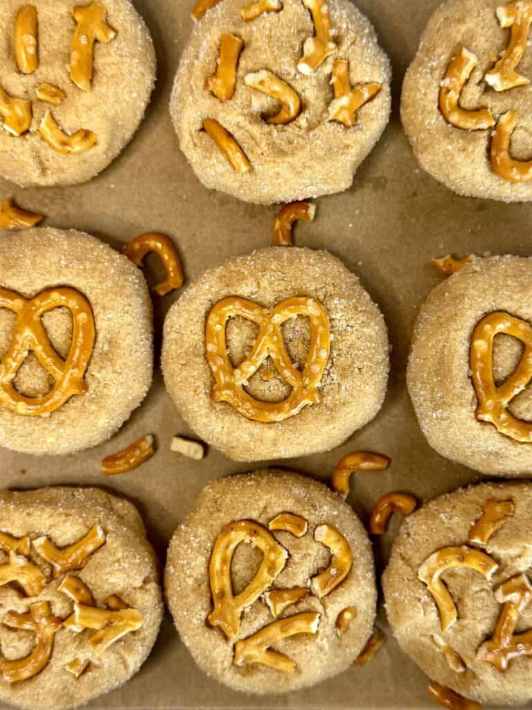 peanut butter pretzel cookies- OH cookies scooped and garnished with crushed and whole pretzels