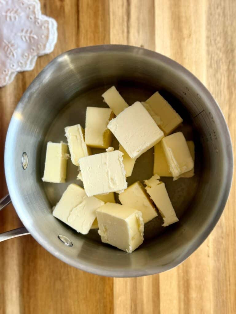 brown butter pumpkin cake-brown butter step 1-butter slices in saucepan