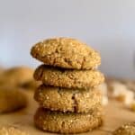 ginger molasses cookies- feature photo- stack of cookies with ginger in background