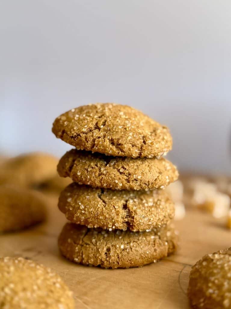 ginger molasses cookies- feature photo- stack of cookies with ginger in background