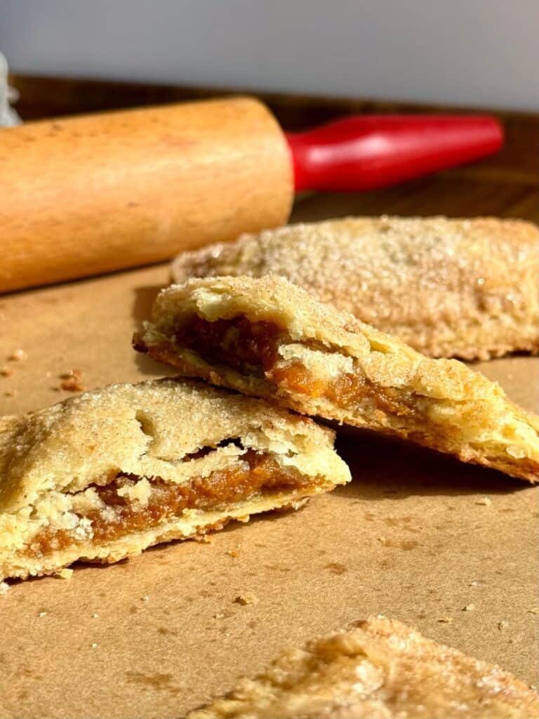 sweet potato hand pie cut in half flaky crust and sweet potato filling