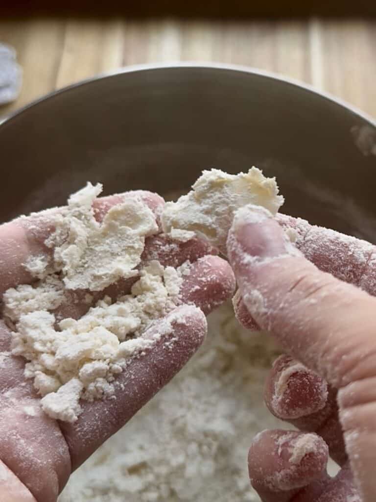 sweet potato hand pies rich pie dough pressing butter into flaky pieces