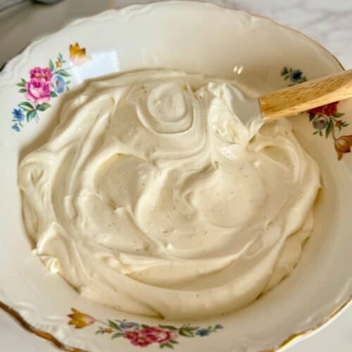 flourless red velvet torte-light and fluffy cream cheese whipped topping in decorative bowl with spatula