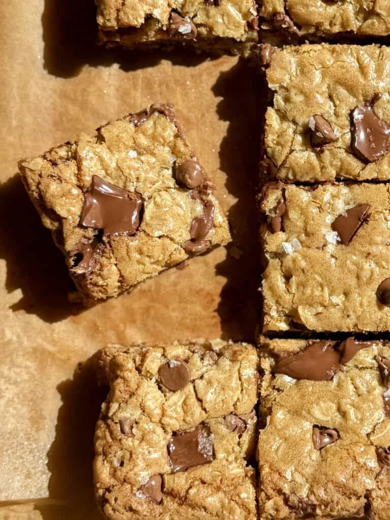 oatmeal chocolate chip cookie bars sliced with one bar pulled away 