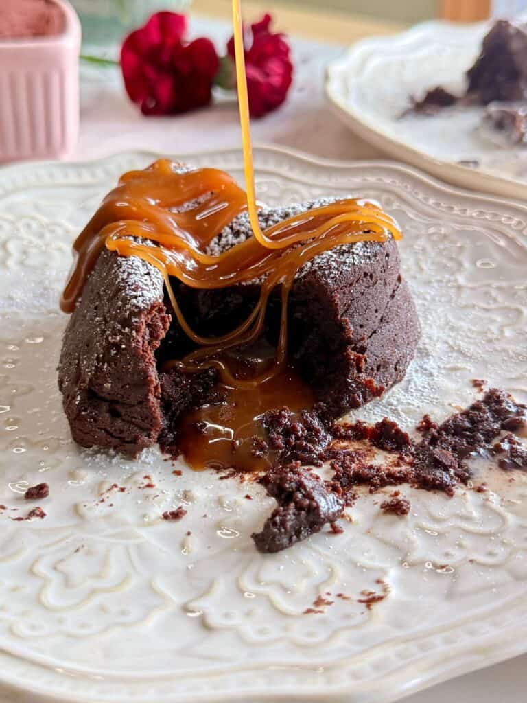 salted caramel molten lava cakes - cake with caramel oozing our of center and more being drizzled on top