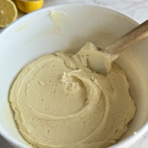 lemon blueberry loaf cake batter in white bowl