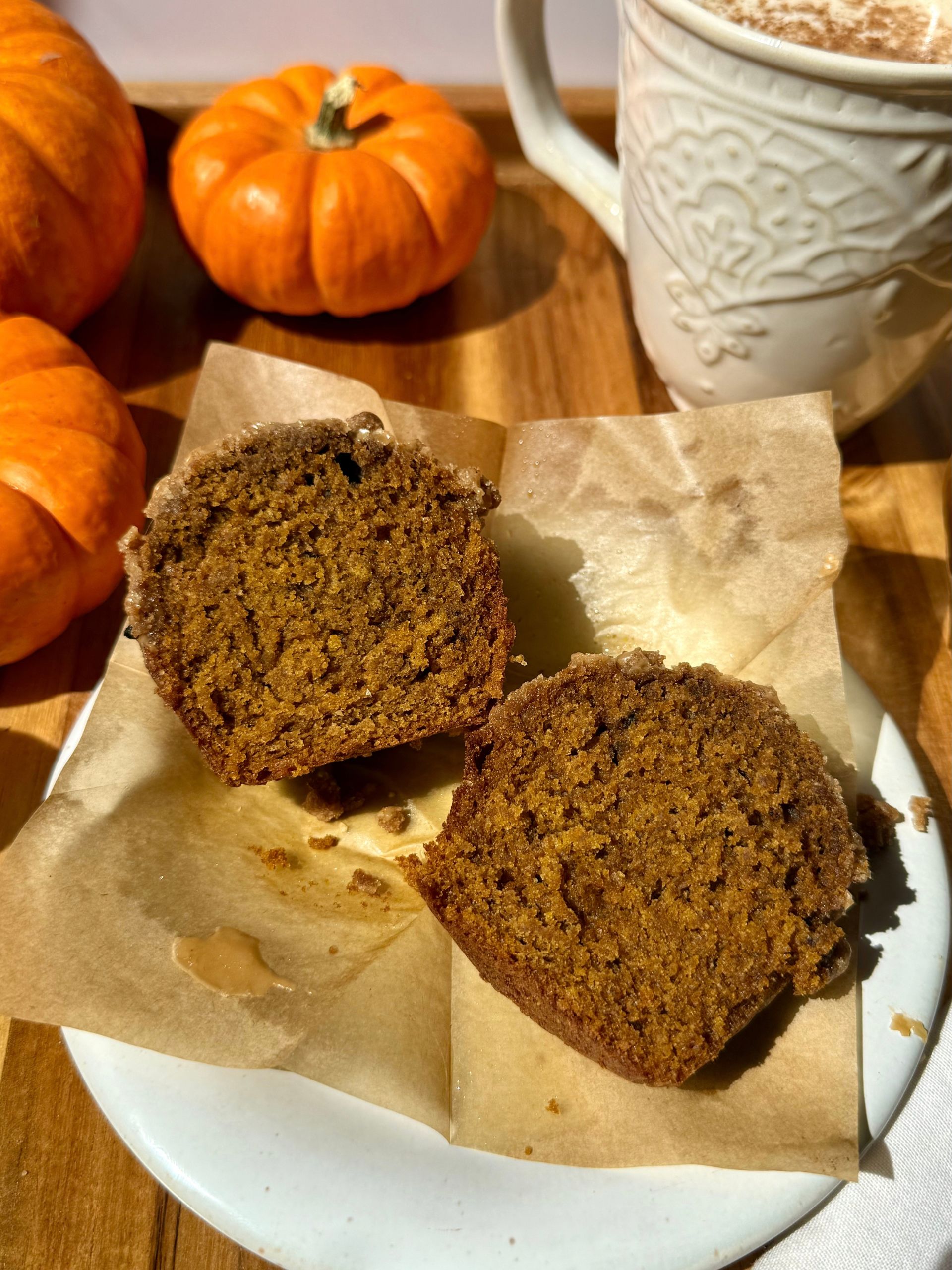pumpkin spice latte muffin cut in half showing moist and fluffy texture